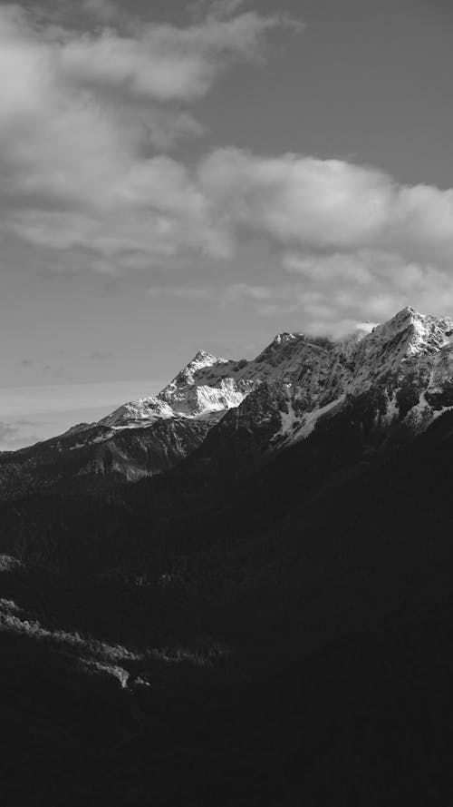 Monochrome Photo of Snow Capped Mountains 