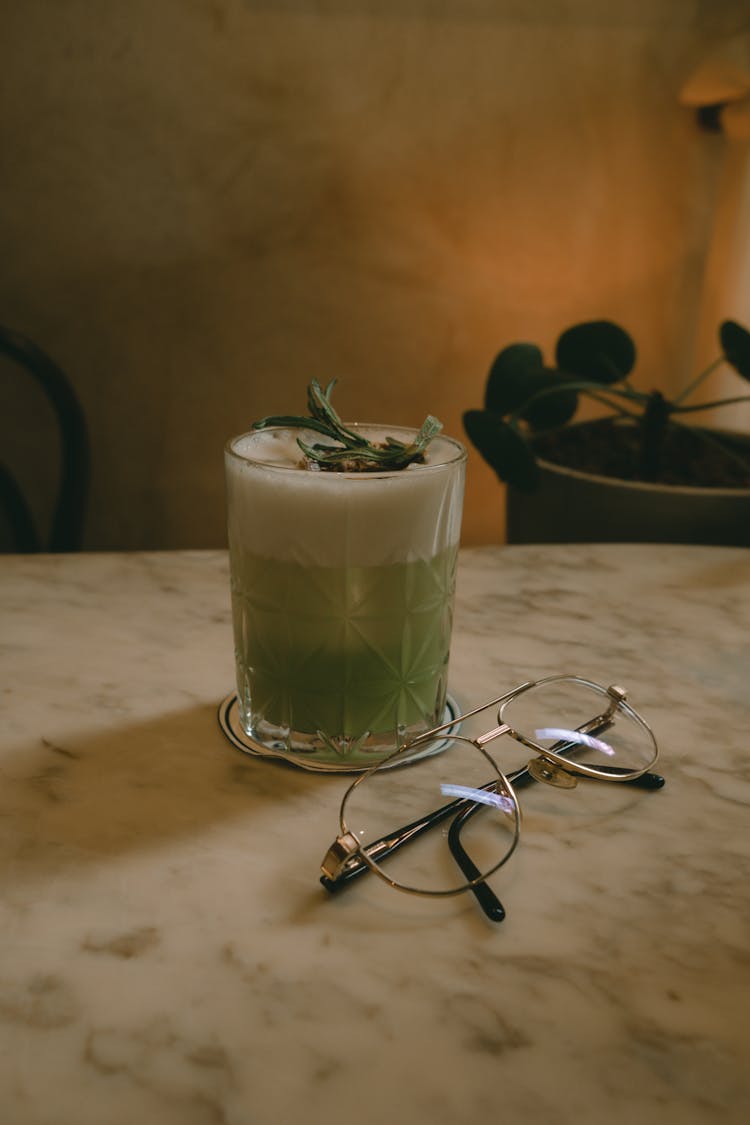 Matcha Latte And Glasses On Table