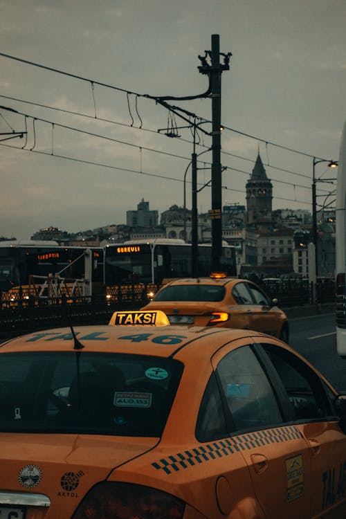 Free A Two Taxi Vehicles on the Road  Stock Photo