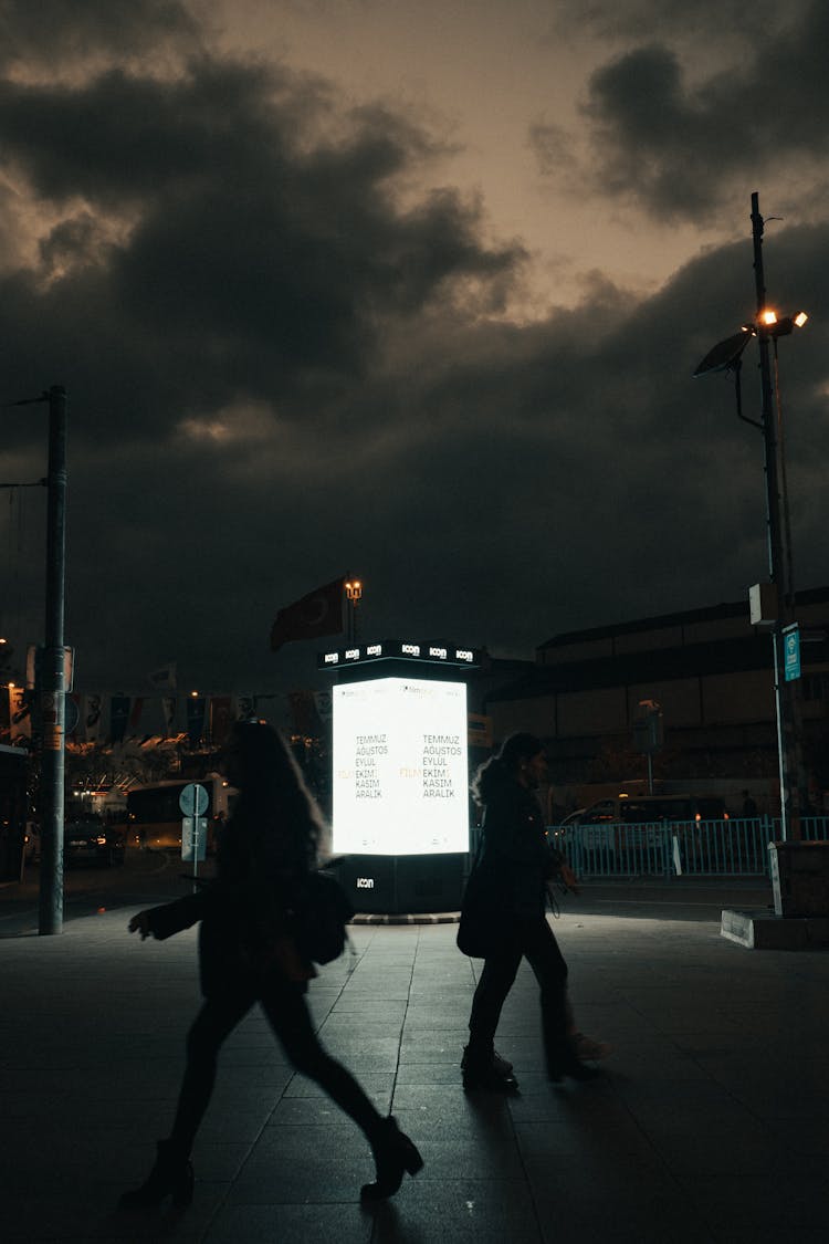 People Walking On Street During Night Time