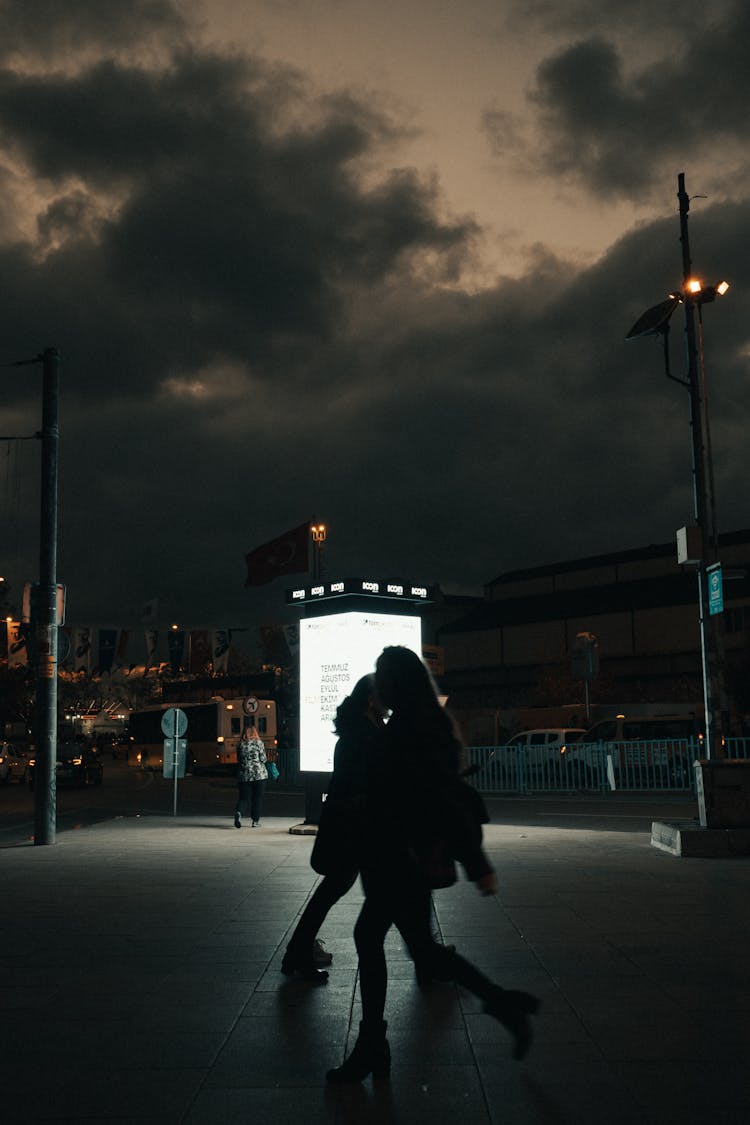 People Walking On Street During Night Time