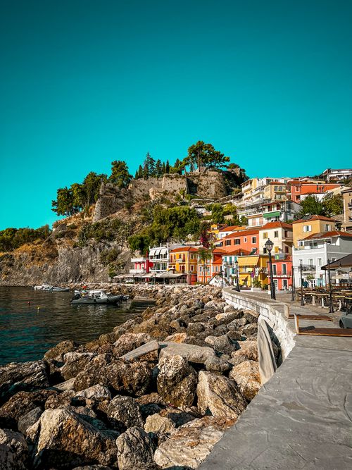 Free Vibrant seaside town of Parga with colorful houses and scenic landscapes. A perfect travel destination. Stock Photo