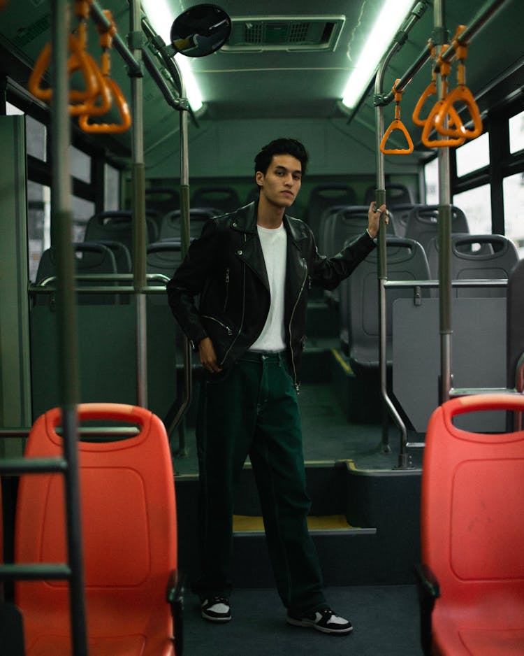 A Man Standing In The Bus