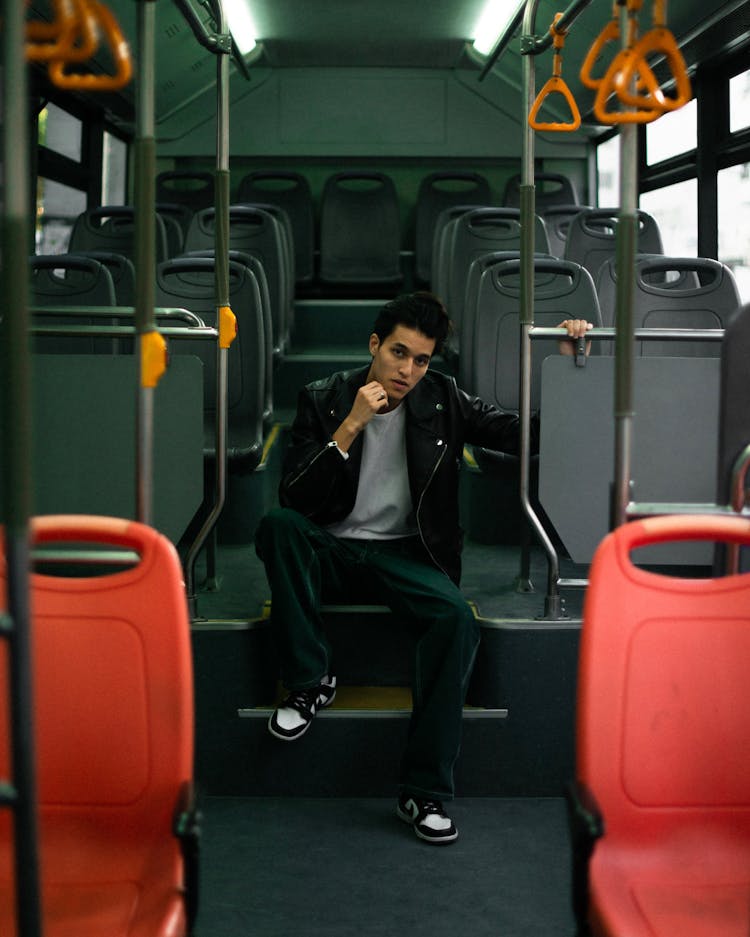 A Man Riding In A Bus