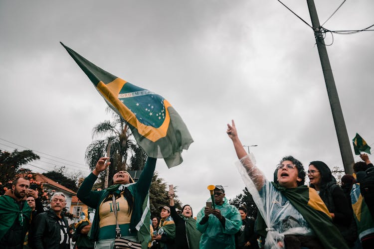 Photo Of A Group Of People With Brazilian Flags