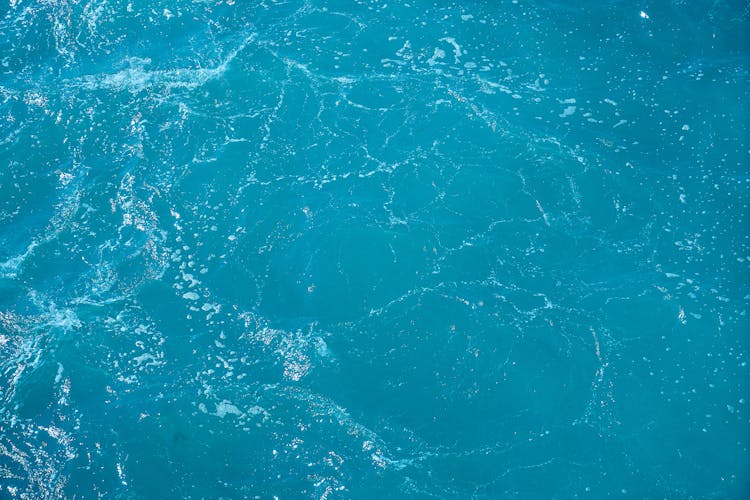 Close-up Photo Of Blue Body Of Water