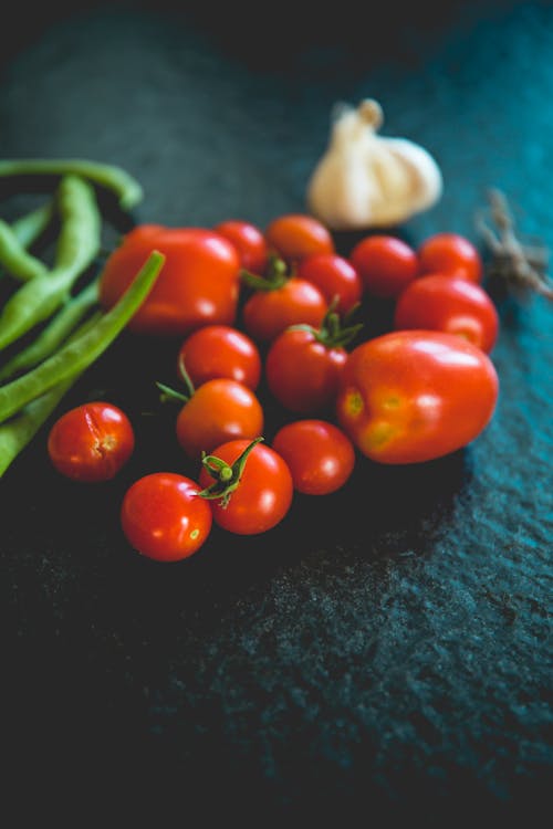 Free Red Tomatoes on Black Textile Stock Photo