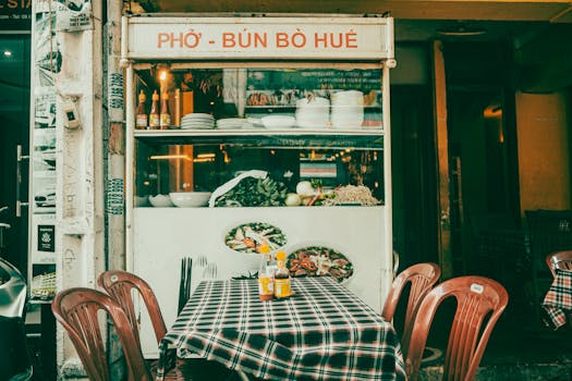 Authentic Vietnamese pho shop in Ca Mau with traditional dishes and inviting outdoor seating.