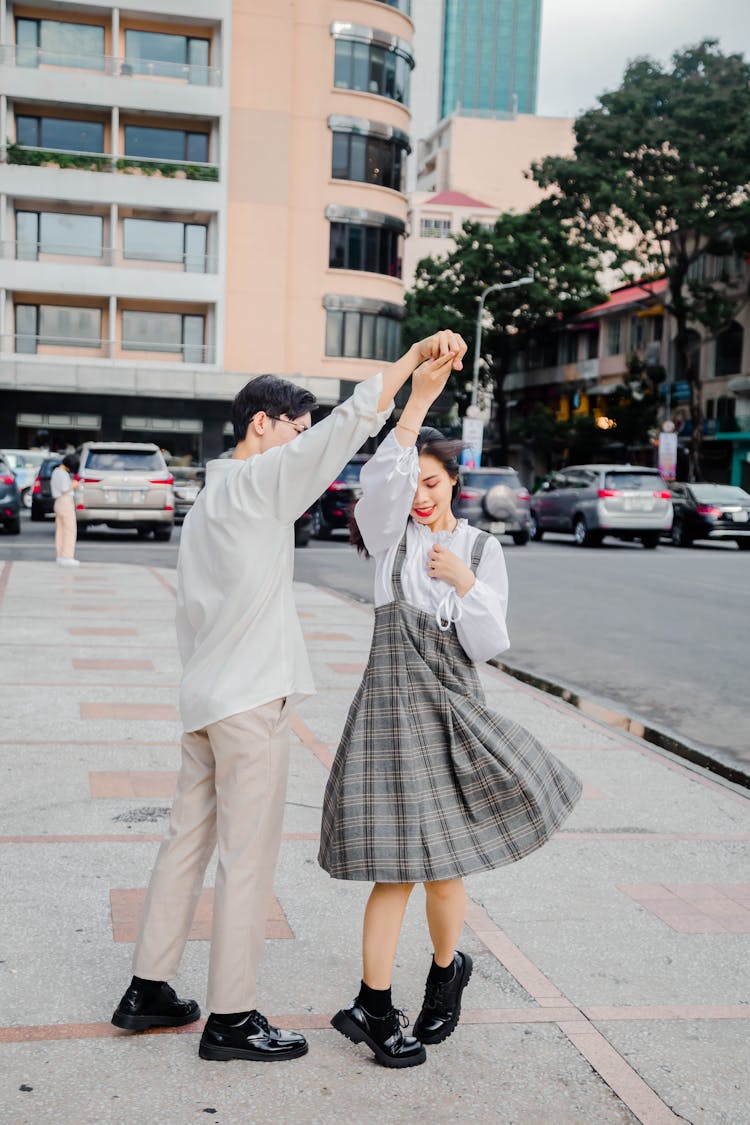 A Couple Dancing On The Street