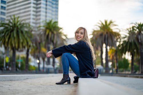 A Woman in Black Long Sleeves Smiling