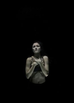 Figure submerged in dark water, photo by Engin Akyurt on Pexels