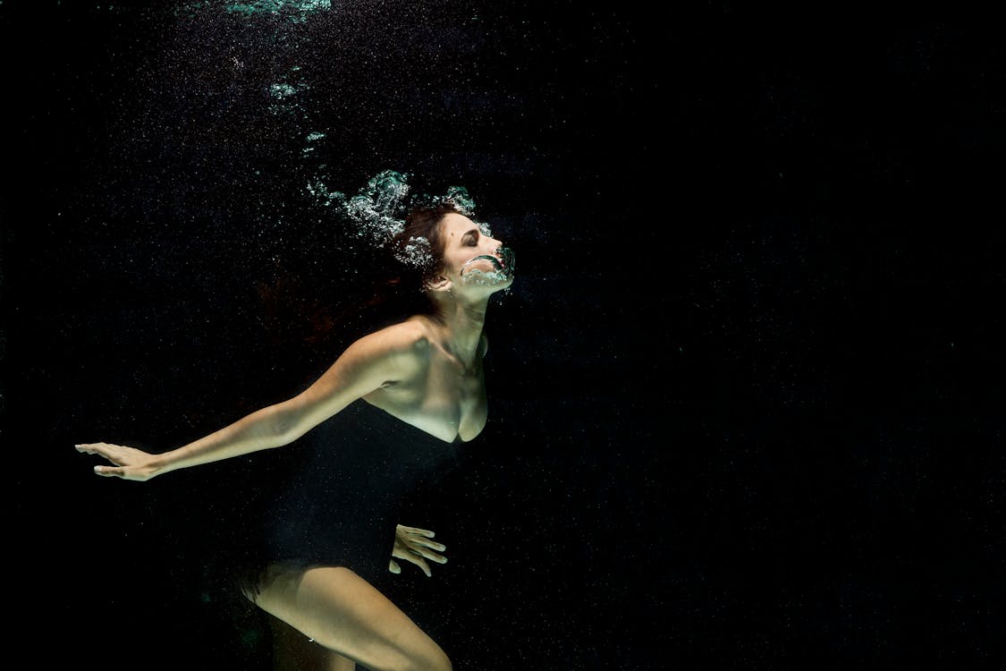 Free Woman Wearing Black Dress Under Water Photography Stock Photo