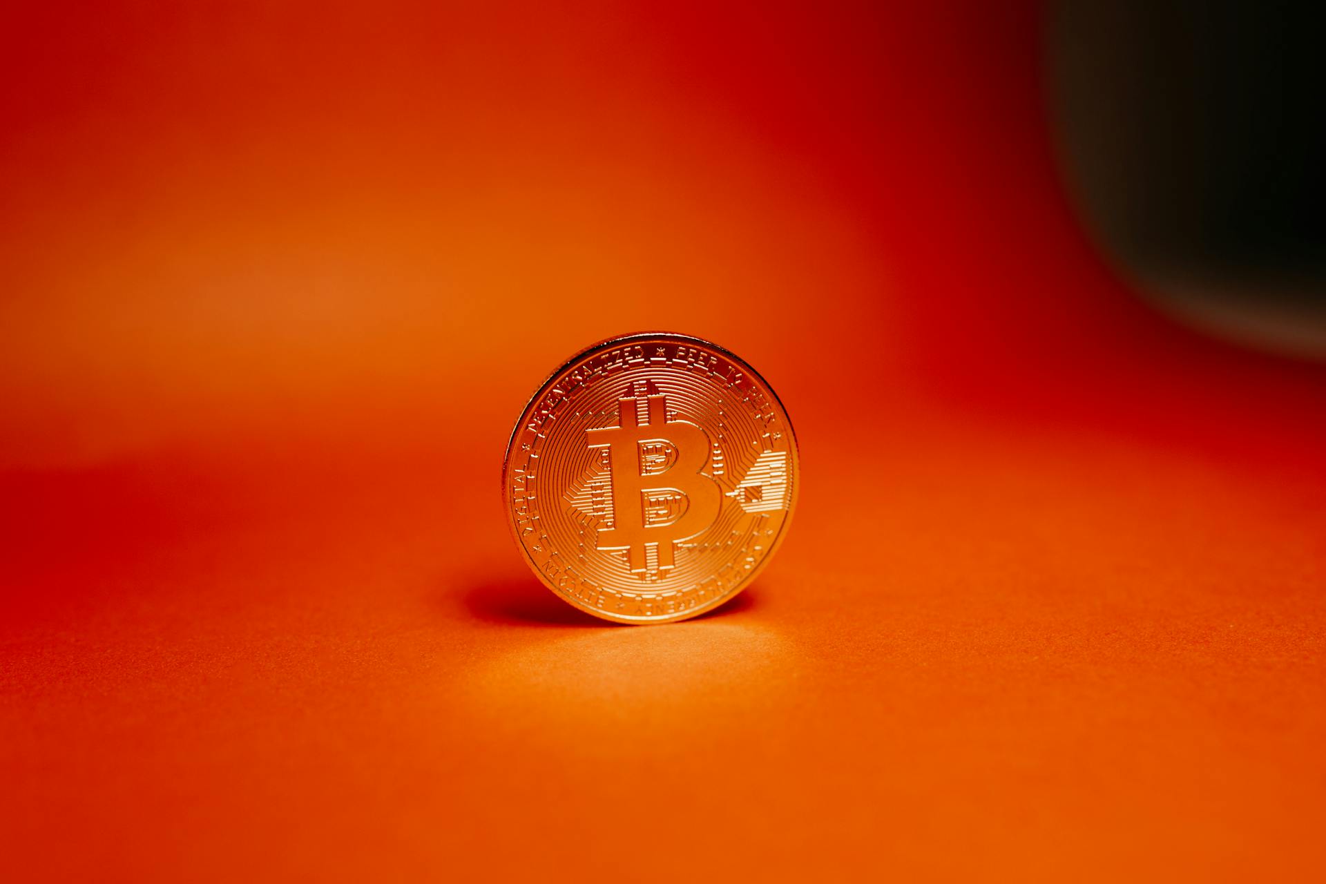 Round Silver Coin on Red Surface