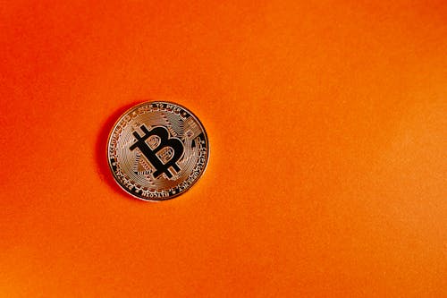 Безкоштовне стокове фото на тему «Bitcoin, orange_background, монета»