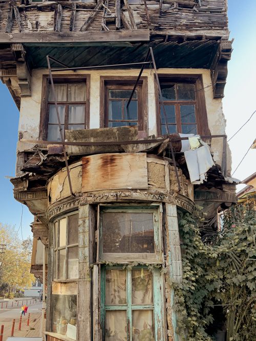 Free Vertically captured image of a dilapidated wooden house. Shows decay and rustic architecture. Stock Photo