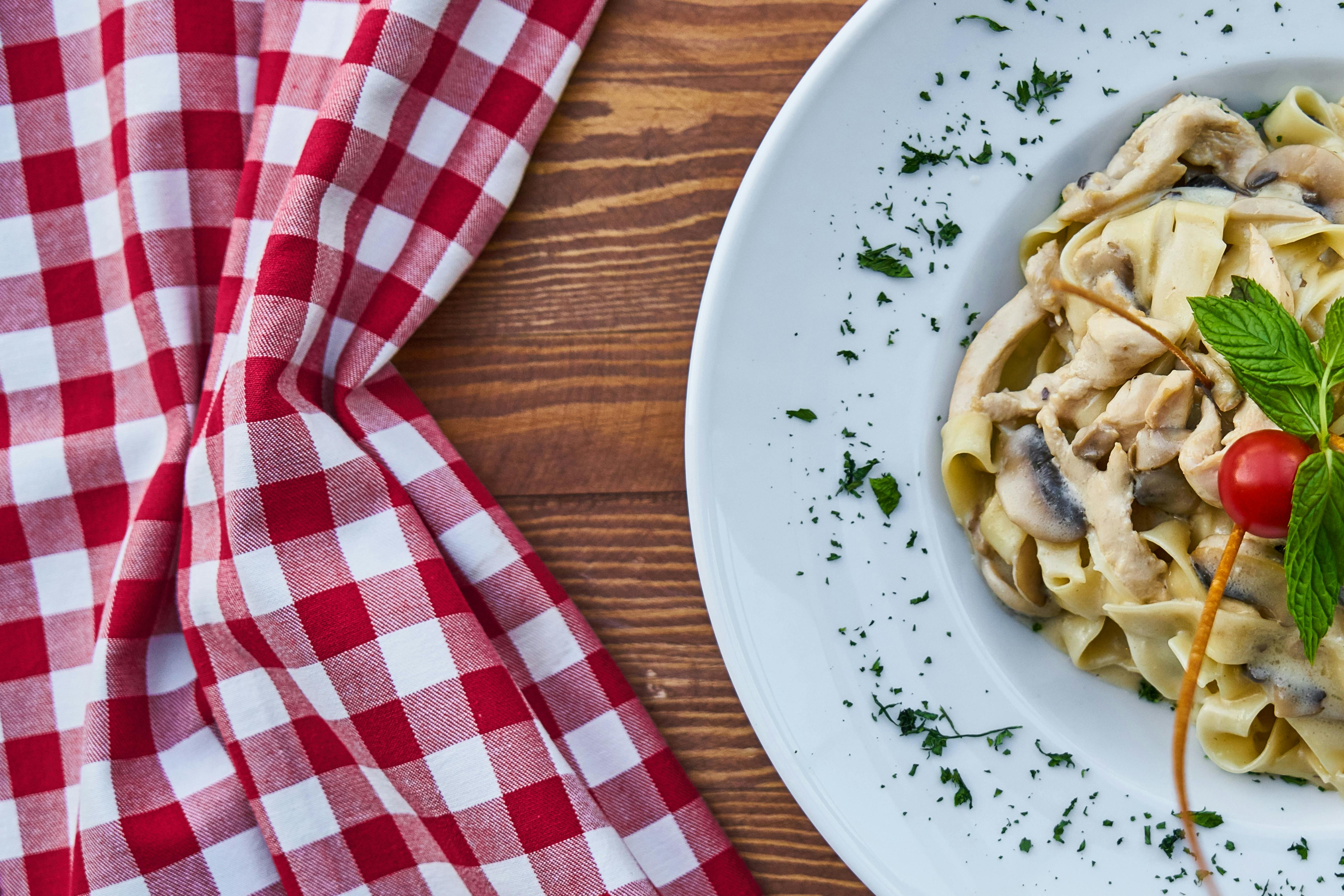 plate of pasta with cherry tomato