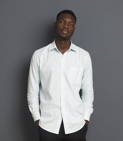 A Man Wearing White Button Up Long Sleeves