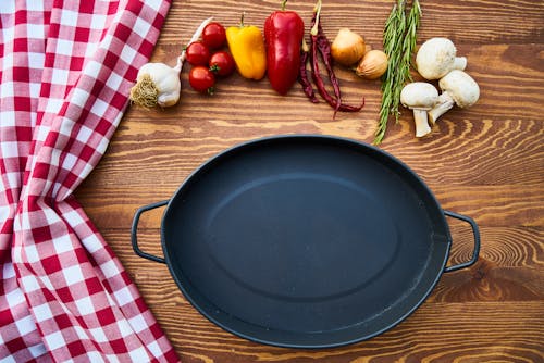 Free Cast Iron Skillet on Table With Species Stock Photo