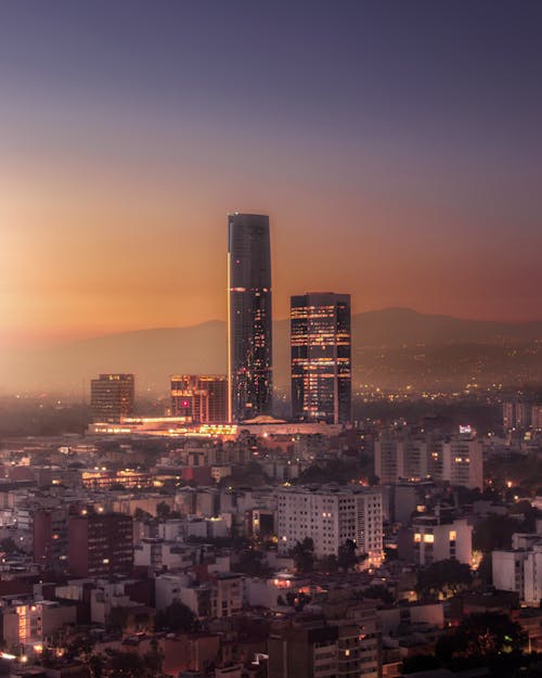 Free View of Skyscrapers in Downtown Mexico City at Sunset Stock Photo