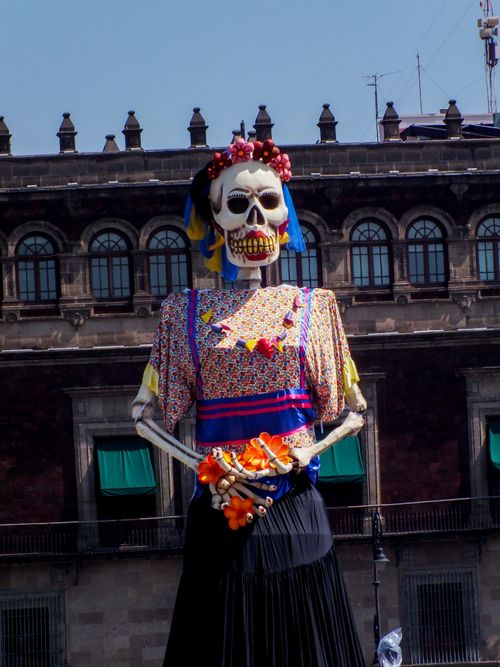 Free A vibrant Day of the Dead effigy in front of a historic building in Mexico City. Stock Photo