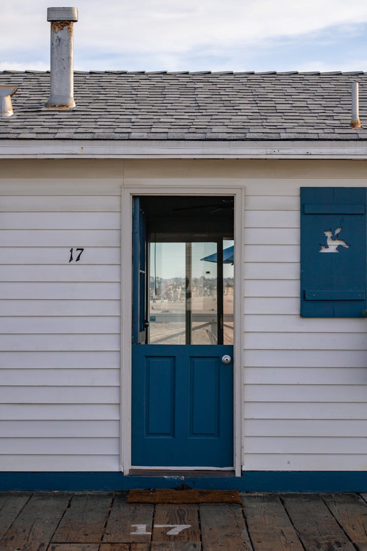 Cabin With Blue Wooden Door 