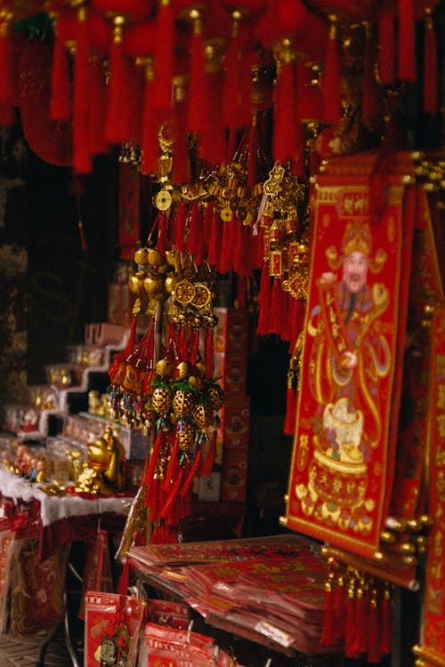 Assorted Gold and Red Chinese Lucky Charms on Display