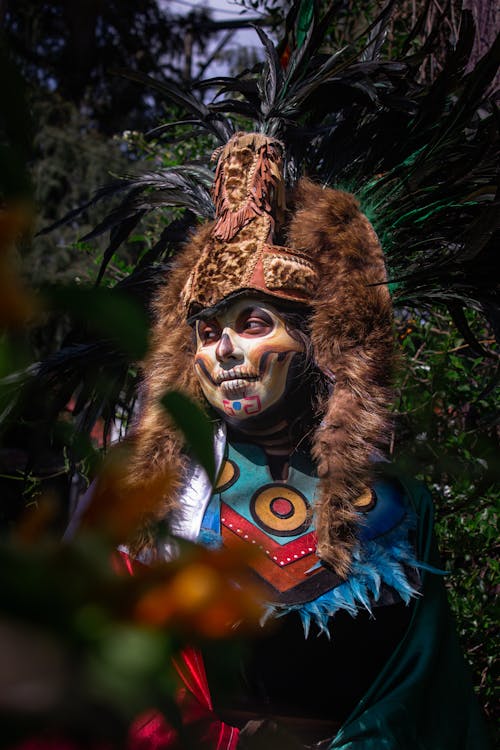 Woman in a Colorful Costume and Skull Makeup 