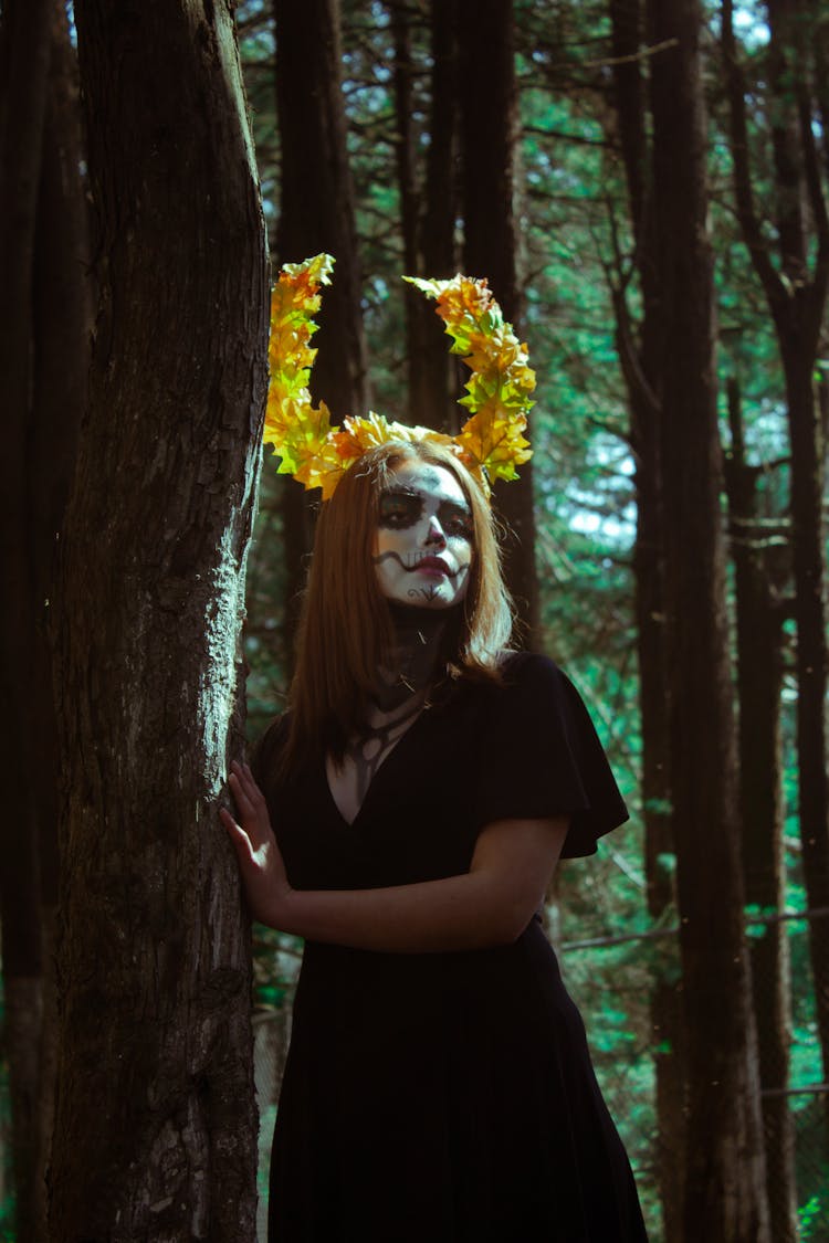 Woman Posing With Painted Face And Horns