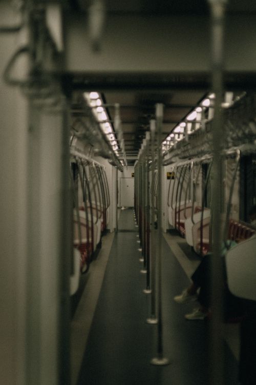 Free A moody shot of an empty subway car showcasing symmetry and soft lighting. Stock Photo