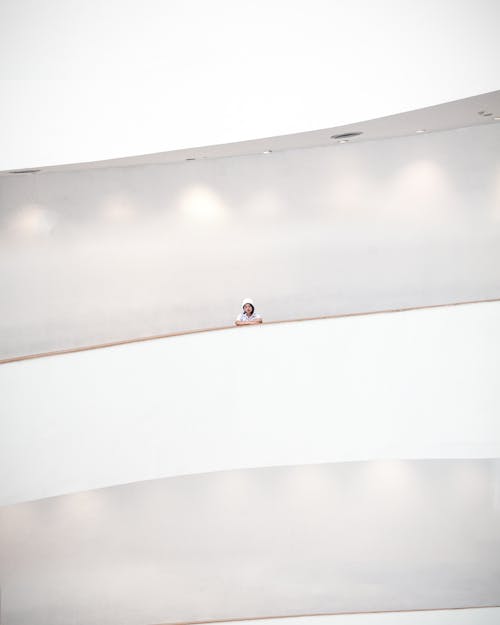 Woman Standing on a Balcony