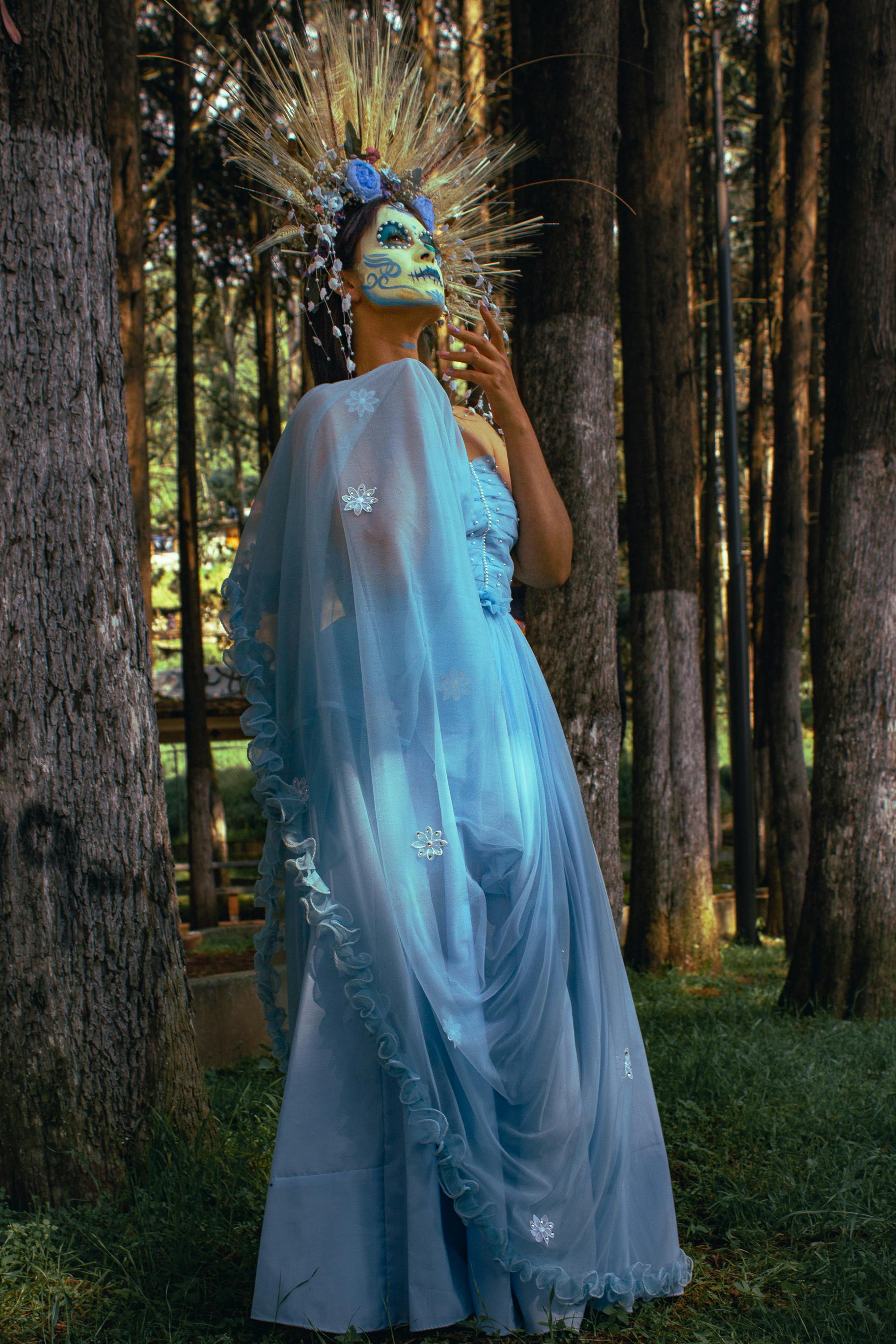 Woman in Blue Dress with Face Paint · Free Stock Photo