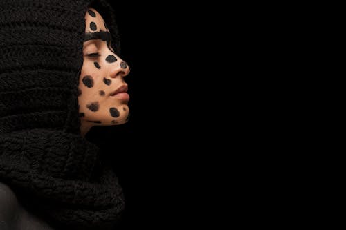 Woman With Black Dots on Face