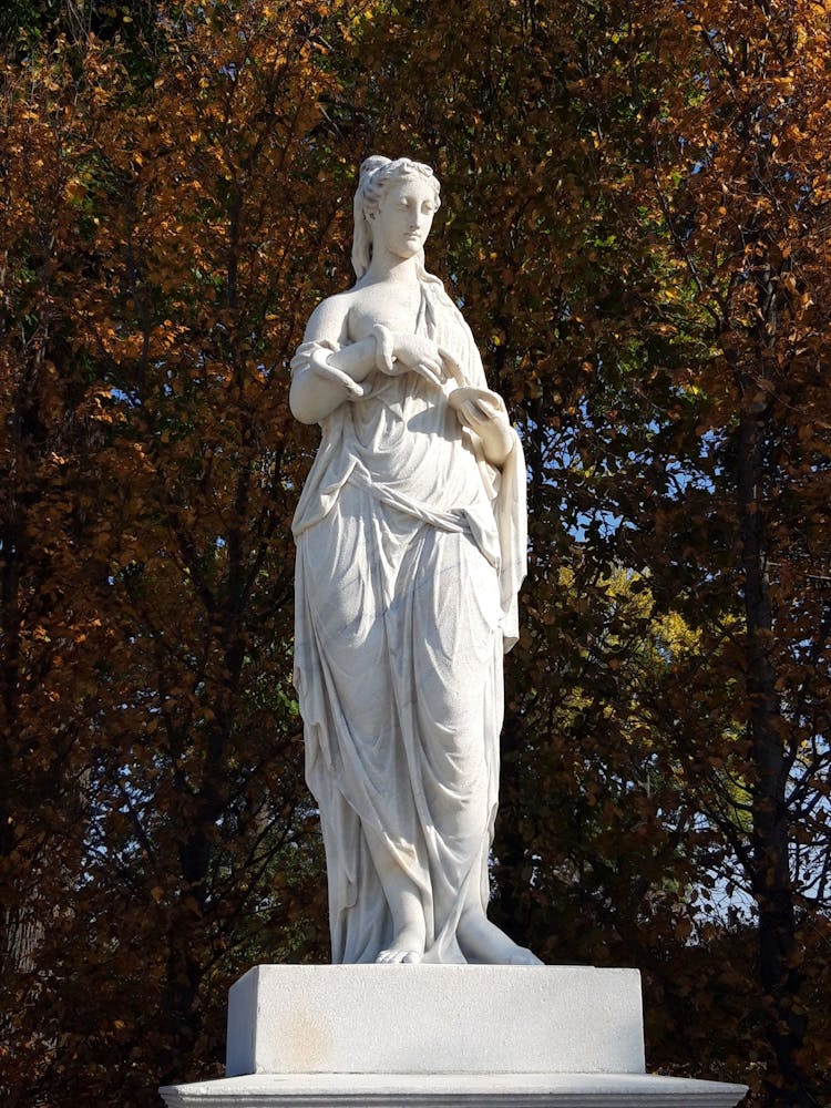 White Statue Near Trees