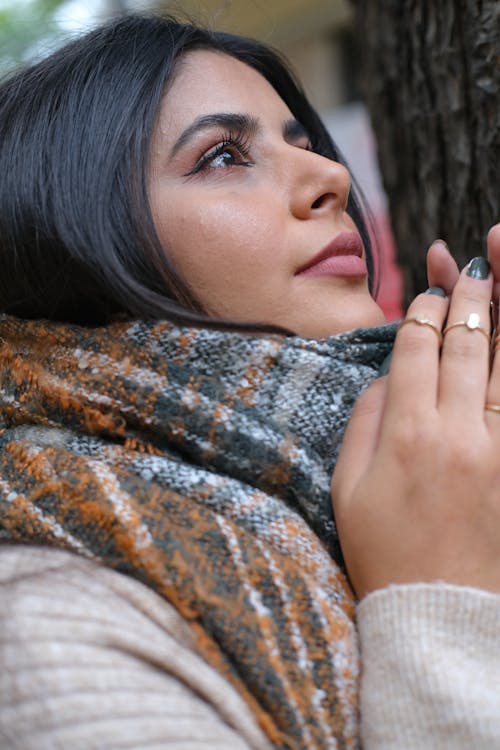 A Woman Touching Her Scarf