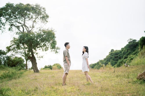 Smiling Couple Standing on the Meadow