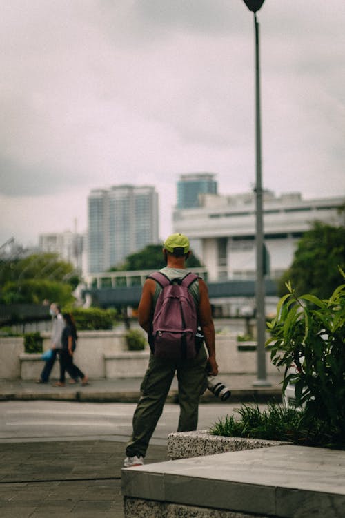 A Man Standing with Backpack