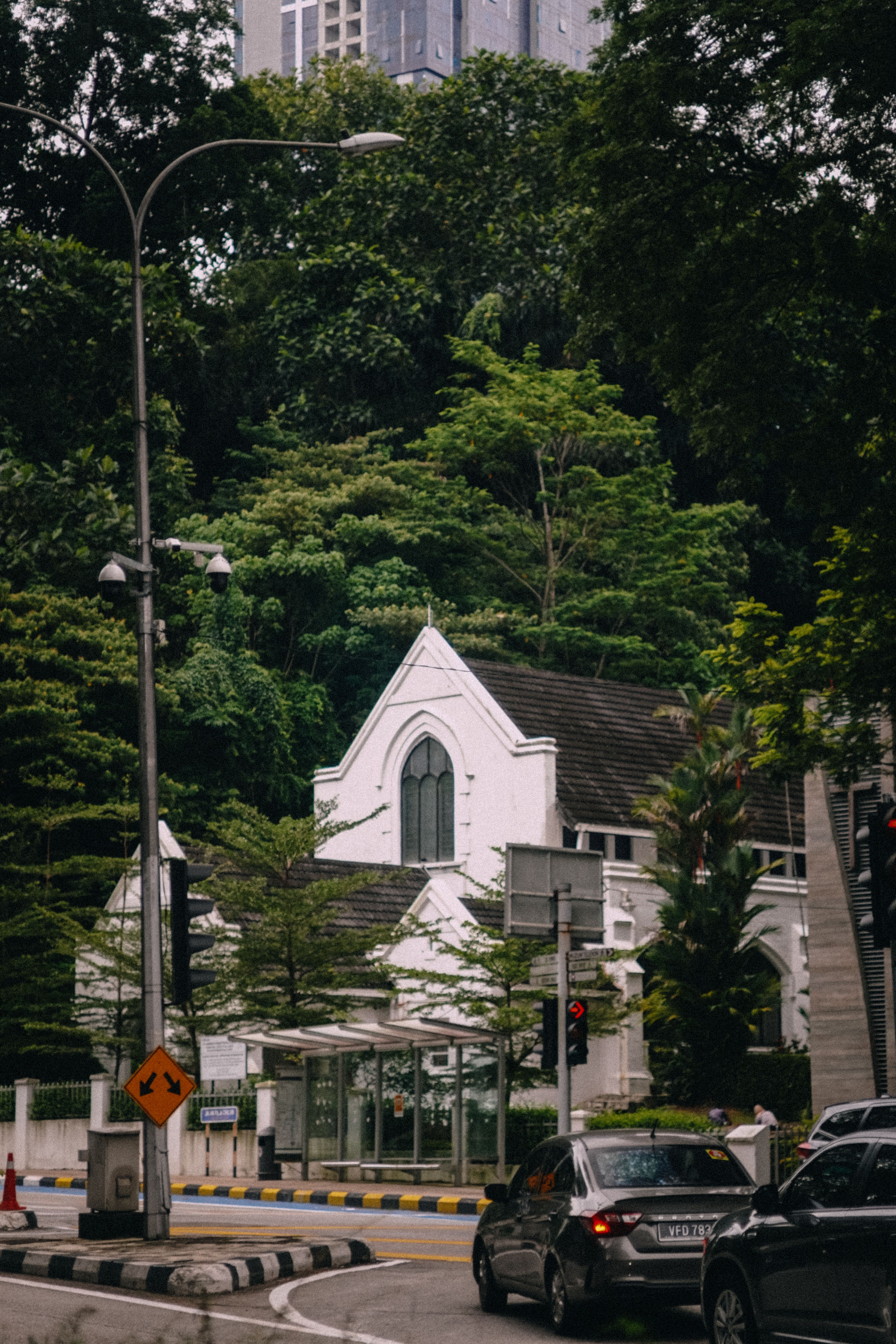 White and Black Wooden House Near Green Trees · Free Stock Photo