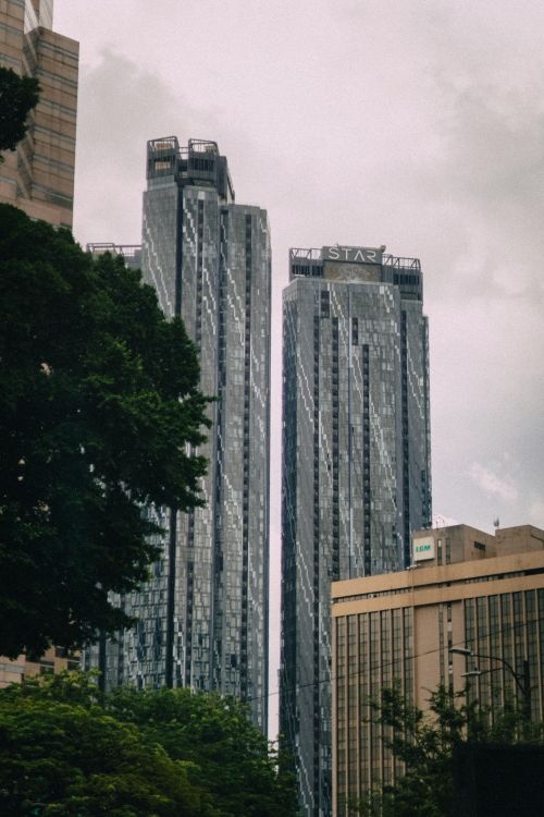 Grey Colorhi Rising Building Gray High Rise Buildings Under Gray Sky · Free Stock Photo
