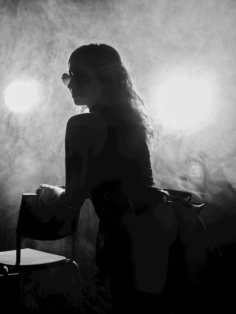 Silhouette Of A Woman With Sunglasses