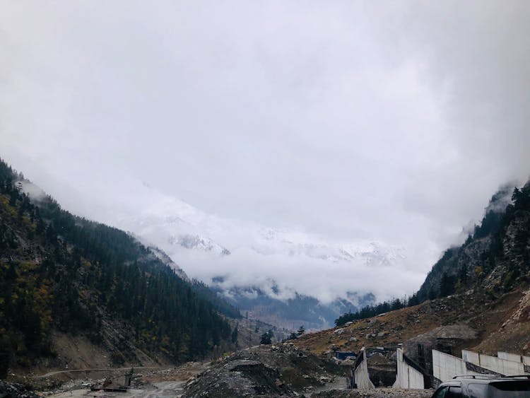 Scenery Of Mountains During Cloudy Sky