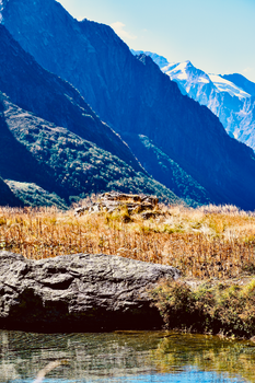 Breathtaking view of snowcapped mountains and serene river