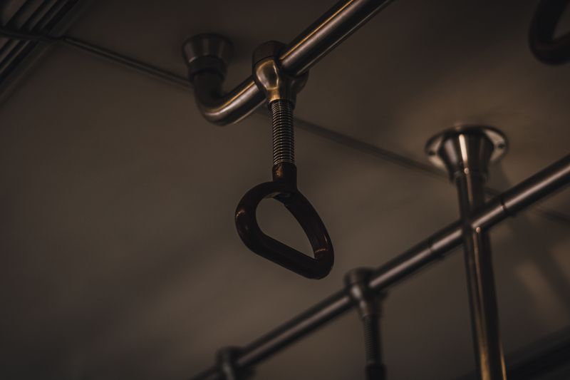 Steel handrail and support on a bus interior