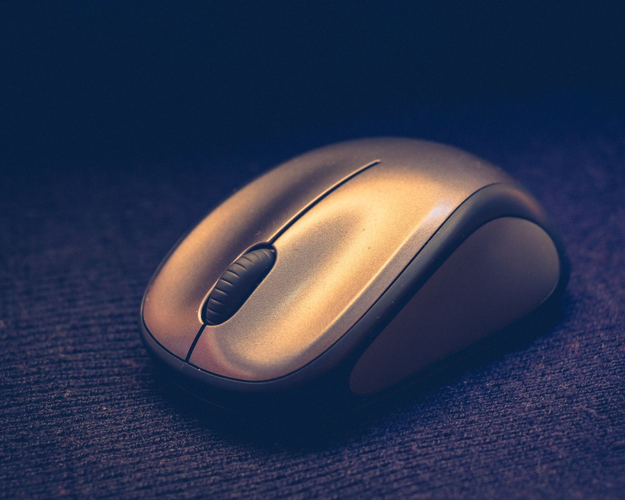 elegant close up of a sleek wireless computer mouse on a textured surf