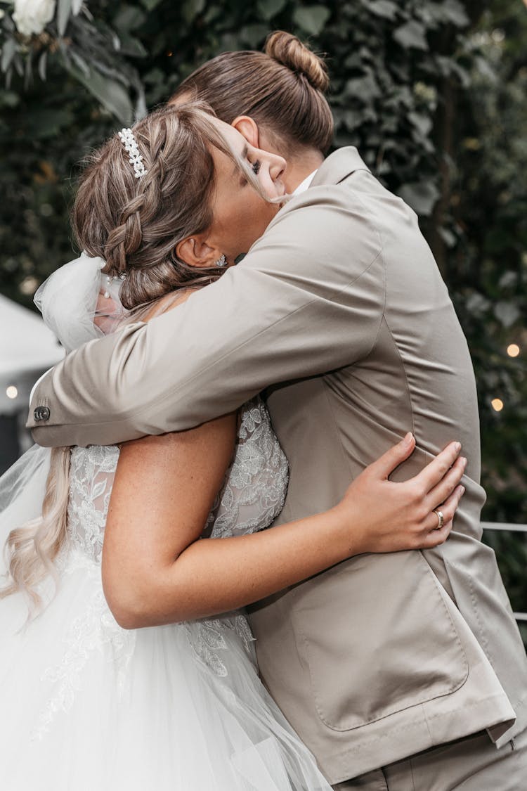 A Groom Hugging A Bride