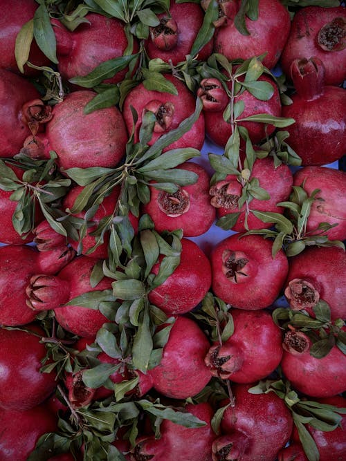 Close Up Photo of a Bunch of Fresh Pomegranates