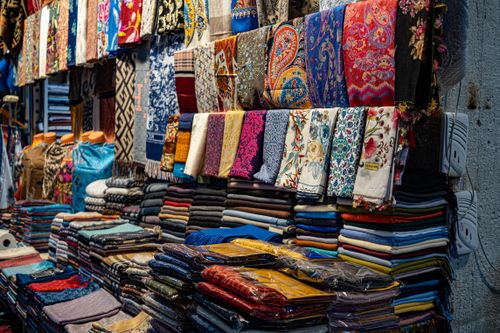Free A colorful array of fabrics and headscarves displayed at an Istanbul market, showcasing local culture. Stock Photo