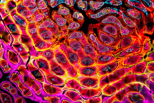 Colorful abstract design with vibrant multicolored patterns and round shapes.