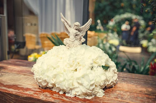 Close up of a Figurine and Flowers