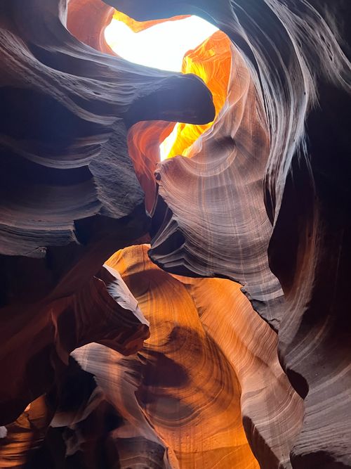 Free Breathtaking shot of Antelope Canyon's illuminated sandstone formations in Arizona. Stock Photo