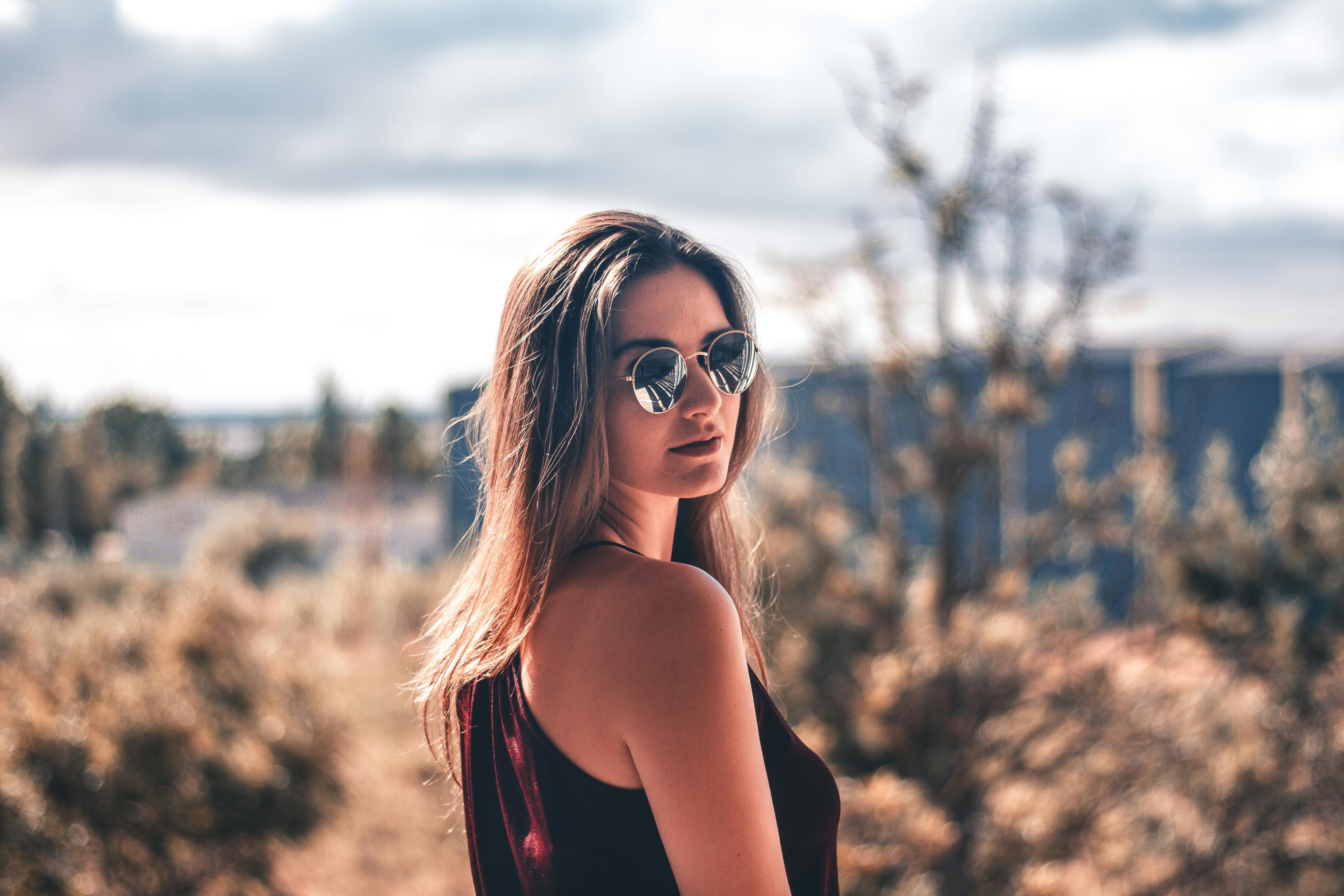 Attractive young african american woman with sunglasses and headband - a  Royalty Free Stock Photo from Photocase